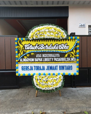 Papan Bunga Duka di Buha
